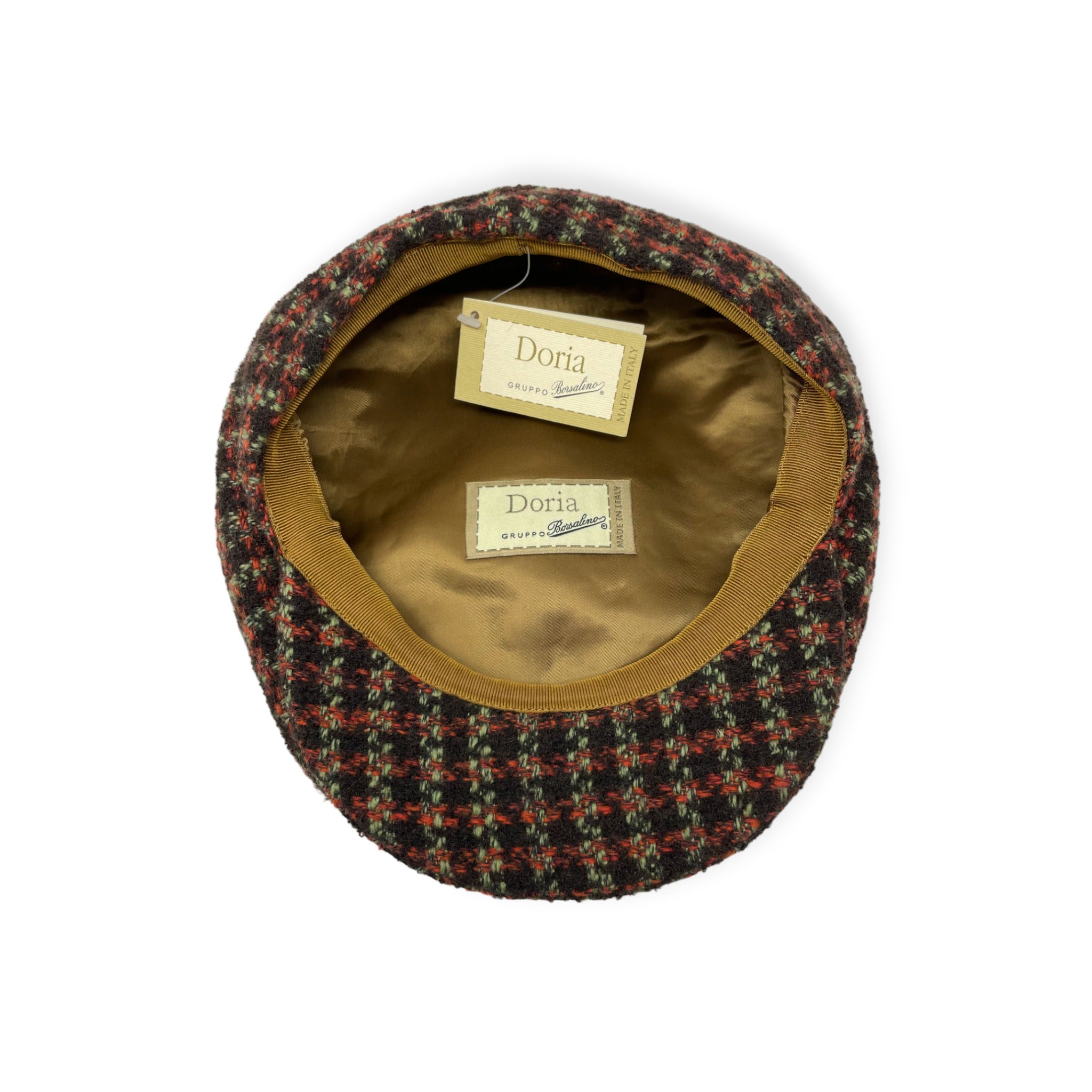 Top down view of the inside of Borsalino tweed newsboy cap with tag and label