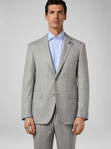 Front view of model wearing Pal Zileri grey check suit with blue dress shirt