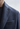 Close up of a shoulder wearing blue suit made by Zegna